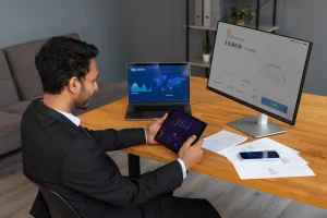 Business professional analyzing cryptocurrency charts on multiple devices, exploring AI finance tools and risks