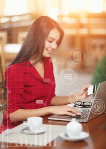 Smiling woman making secure online payment with credit card on laptop, representing digital jobs and e-commerce