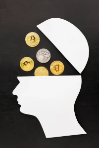 White paper head silhouette with Bitcoin and cryptocurrency coins inside, symbolizing financial mindset and digital currency thinking